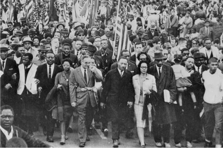 Dr. Martin Luther King leads an estimated 10,000 or more civil rights marchers out on last leg of their Selma-to-Montgomery march on March 25, 1965. UPI File Photo