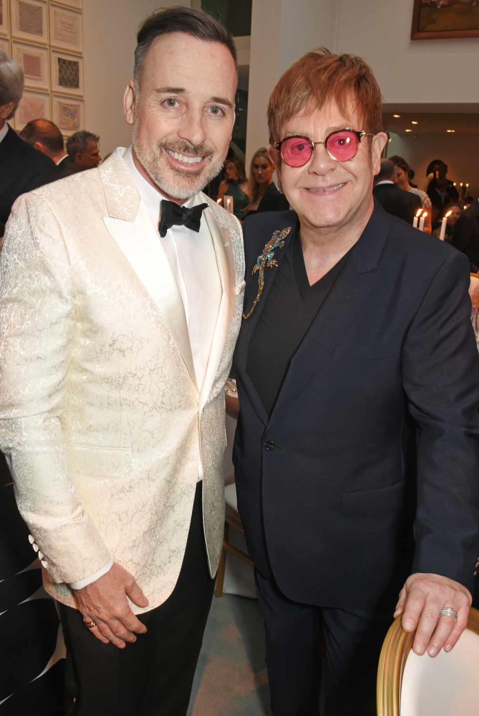 David Furnish (L) and Sir Elton John attend the Woodside Gallery Dinner in benefit of Elton John AIDS Foundation in partnership with BVLGARI at Woodside on June 22, 2017 in Windsor, England