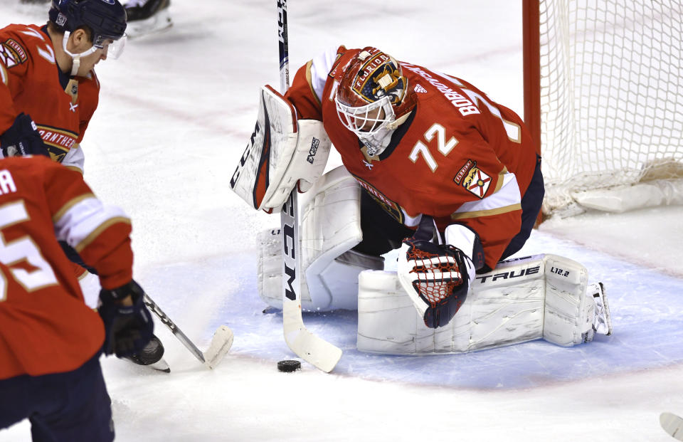Florida Panthers goaltender Sergei Bobrovsky (72) stops a shot by the Detroit Red Wings during the first period of an NHL hockey game Tuesday, Feb. 9, 2021, in Sunrise, Fla. (AP Photo/Jim Rassol)