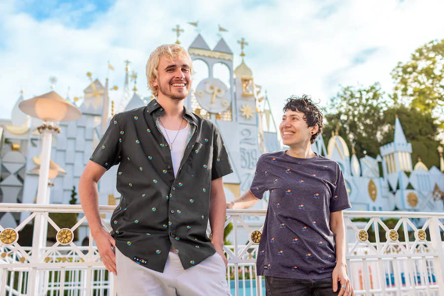 Two members of the LGBTQ community showing off Pixar- and Marvel-themed shirts as part of the Disney Pride Collection, sold at shopdisney.com. (Credit: The Walt Disney Company) 