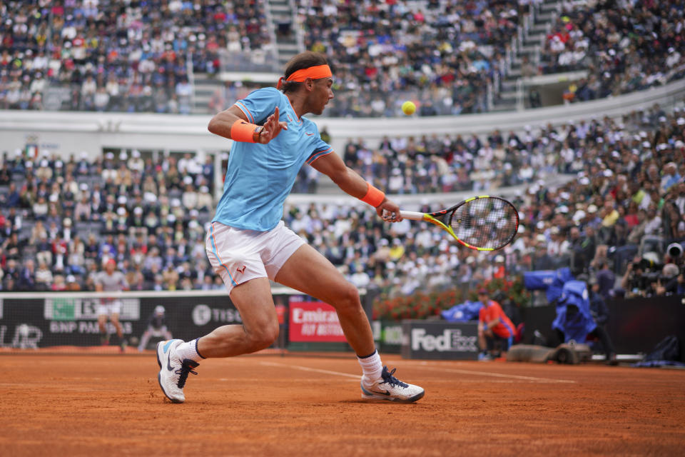 Rafael Nadal of Spain returns the ball to Stefanos Tsitsipas of Greece during a semifinal match at the Italian Open tennis tournament, in Rome, Saturday, May 18, 2019. (AP Photo/Andrew Medichini)