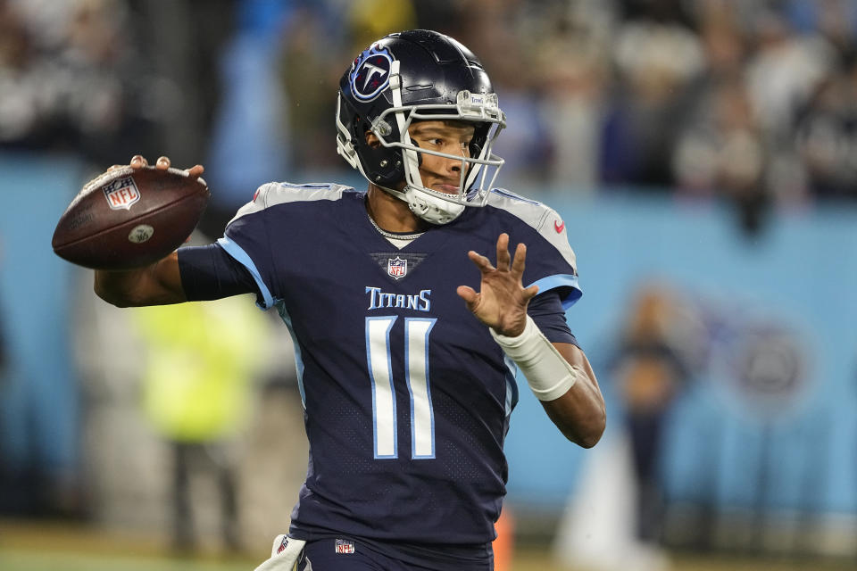 Tennessee Titans quarterback Joshua Dobbs (11) throws out of the pocket against the Dallas Cowboys during the first half of an NFL football game, Thursday, Dec. 29, 2022, in Nashville, Tenn. (AP Photo/Chris Carlson)