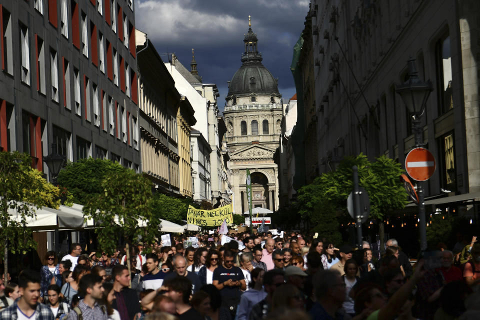 Hungarian students protest in solidarity with their teachers in front of the St. Stephen's Basilica in Budapest, Hungary, Friday, Sept. 2, 2022. The banner says "without teachers there is no future". Public schools in Poland and Hungary are facing a shortage of teachers at a time when both countries are taking in many Ukrainian refugee children. For years, teachers have been fleeing public schools over grievances regarding low wages and a sense of not being valued by their governments. (AP Photo/Anna Szilagyi)