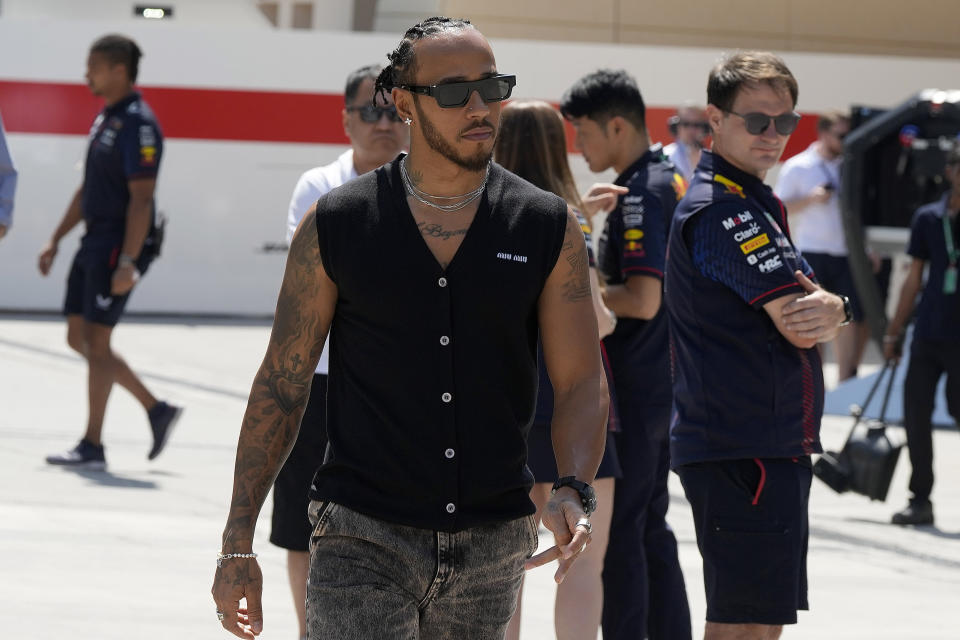 Mercedes driver Lewis Hamilton of Britain arrives for the first Formula One free practice at the Bahrain International Circuit in Sakhir, Bahrain, Friday, March 3, 2023. The Bahrain GP will be held on Sunday March 5, 2023.(AP Photo/Frank Augstein)