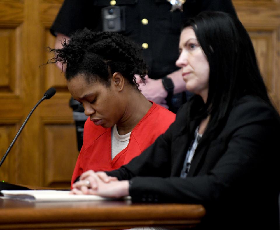 Chabrijuana J. Glenn, left, is shown with defense attorney Tiffany Poirier as she enters a guilty plea in Stark County Common Pleas Court for killing Douglas G. Adkins. Judge Natalie R. Haupt sentenced Glenn to 23 years to life in prison for killing the Canton man.