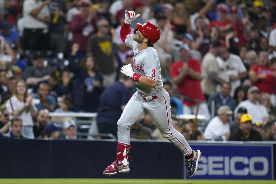 Philadelphia Phillies' Bryce Harper reacts after hitting a two-run home run during the third inning of the team's baseball game against the San Diego Padres, Friday, Aug. 20, 2021, in San Diego. (AP Photo/Gregory Bull)