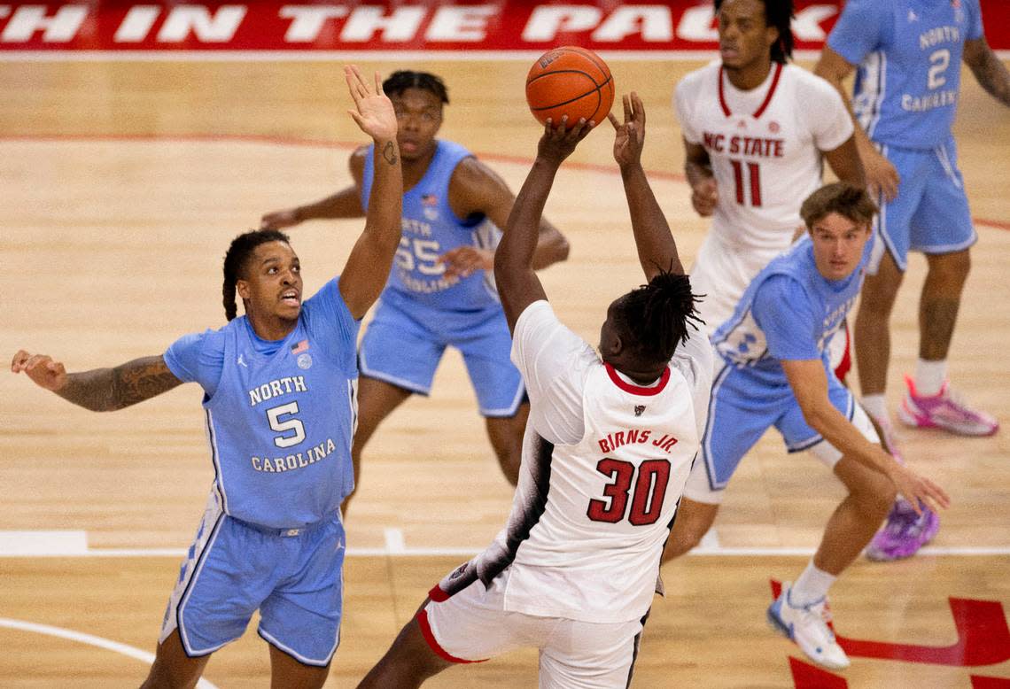 North Carolina’s Armando Bacot (5) defends N.C. State’s D.J. Burns Jr. (30) in the first half on Wednesday, January 10, 2024 at PNC Arena in Raleigh, N.C. The Tar Heels held burns to 11 point in their 67-54 victory.