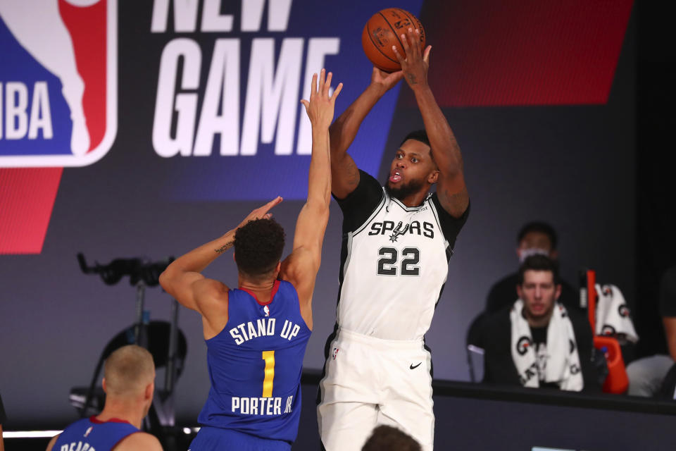 San Antonio Spurs forward Rudy Gay (22) shoots against Denver Nuggets forward Michael Porter Jr. (1) during the first half of an NBA basketball game Wednesday, Aug. 5, 2020, in Lake Buena Vista, Fla. (Kim Klement/Pool Photo via AP)