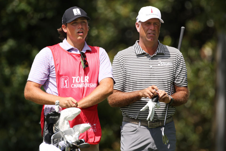 Stewart Cink of the United States talks with his caddie and son Reagan Cink on the second tee during the first round of the TOUR Championship at East Lake Golf Club on September 02, 2021 in Atlanta, Georgia. (Photo by Kevin C. Cox/Getty Images)