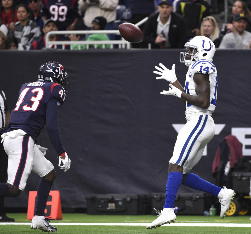 Indianapolis Colts wide receiver Zach Pascal (14) makes a touchdown catch as Houston Texans defensive back Shareece Wright (43) defends during the second half of an NFL football game Sunday, Dec. 9, 2018, in Houston. (AP Photo/Eric Christian Smith)