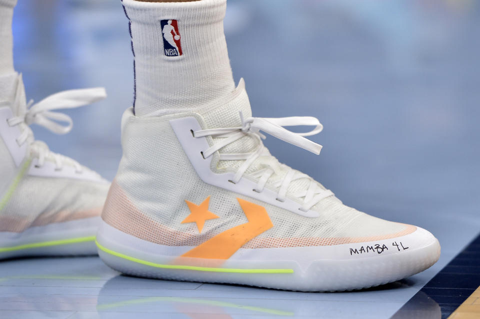 Phoenix Suns forward Kelly Oubre Jr. wears shoes with a tribute message to the late Kobe Bryant in the first half of an NBA basketball game against the Memphis Grizzlies, Sunday, Jan. 26, 2020, in Memphis, Tenn. (AP Photo/Brandon Dill)