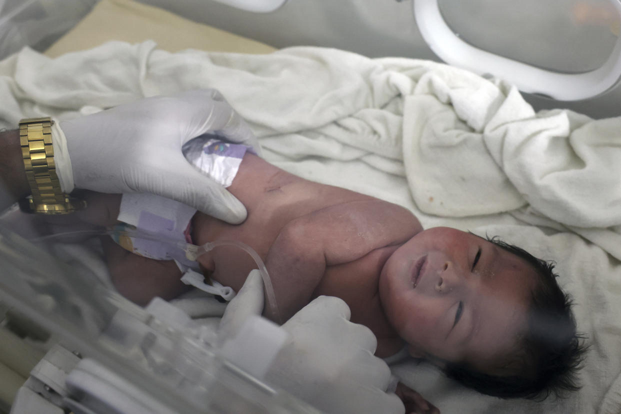 A baby girl who was born under the rubble caused by an earthquake that hit Syria and Turkey receives treatment inside an incubator at a children's hospital in the town of Afrin, Aleppo province, Syria, Tuesday, Feb. 7, 2023. Residents in the northwest Syrian town discovered the crying infant whose mother gave birth to her while buried underneath the rubble of a five-story apartment building levelled by this week’s devastating earthquake, relatives and a doctor say. (AP Photo/Ghaith Alsayed)