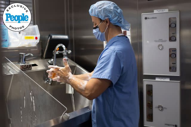 <p>Haley Ricciardi / Hassenfeld Children's Hospital at NYU Langone</p> Cooper's surgeon, Dr. Adam Griesemer, scrubbing into surgery