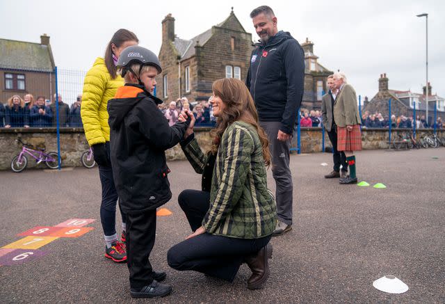 <p>Jane Barlow - WPA Pool/Getty</p> Kate Middleton comforts boy who fell off bike in Scotland on Nov. 2.