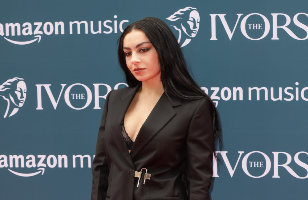 Charli XCX says her 1975 drummer and lyricist boyfriend has influenced her to 'take some time' when creating new music credit:Bang Showbiz