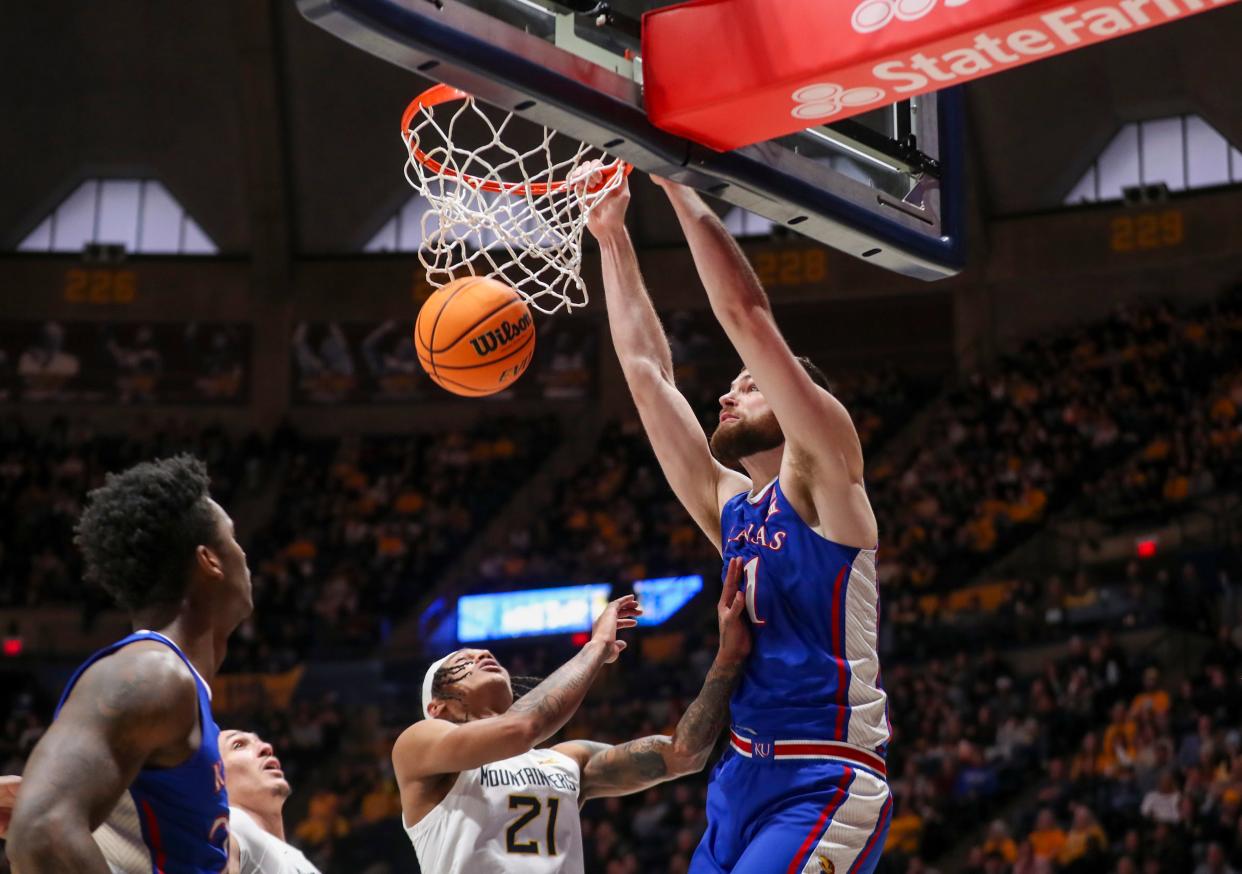 Hunter Dickinson, shown here against West Virginia Saturday, is a 7-foot-2 center who transferred in from Michigan and  is averaging 19.2 points per game. He has 10 double-doubles this season.