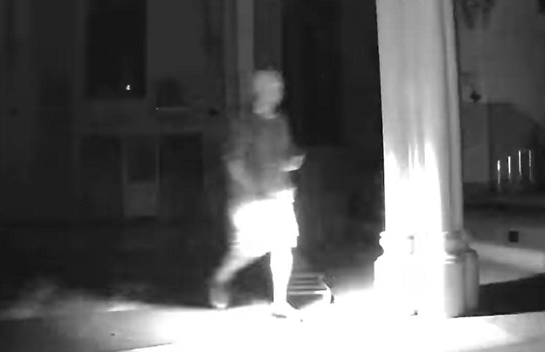 Still clip from surveillance video showing a suspected trespasser inside St. Boniface Church in Manitowoc.