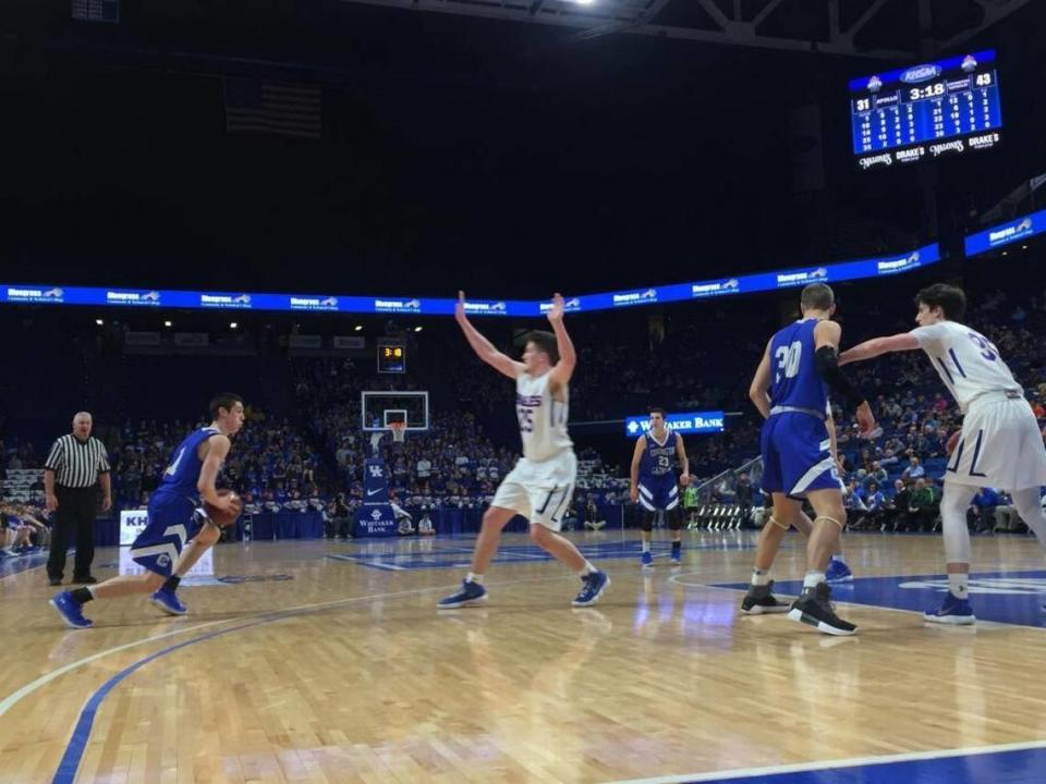 In four games for Covington Catholic in the 2018 Kentucky Sweet Sixteen in Rupp Arena, CJ Fredrick, left, averaged 27.8 points per game while leading the Colonels to the state title.