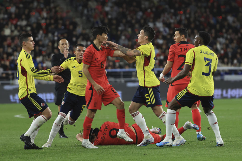 South Korea's Hwang In-beom, center left, argues with Colombia's Matheus Uribe, center right, during their friendly soccer match between South Korea and Colombia in Ulsan, South Korea, Friday, March 24, 2023. (Kim Do-hun/Yonhap via AP)