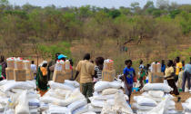 South Sudanese refugees displaced by fighting, wait to recieve food rations in Imvepi settlement in Arua district, northern Uganda, April 4, 2017. Picture taken April 4, 2017. REUTERS/James Akena