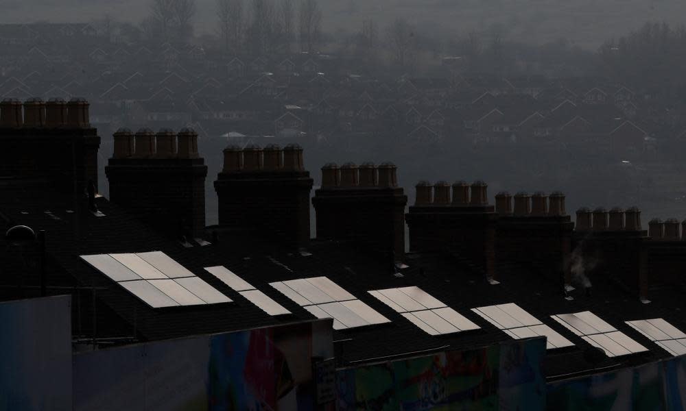 Rooftop solar panels reflect the sun in Stoke on Trent, UK