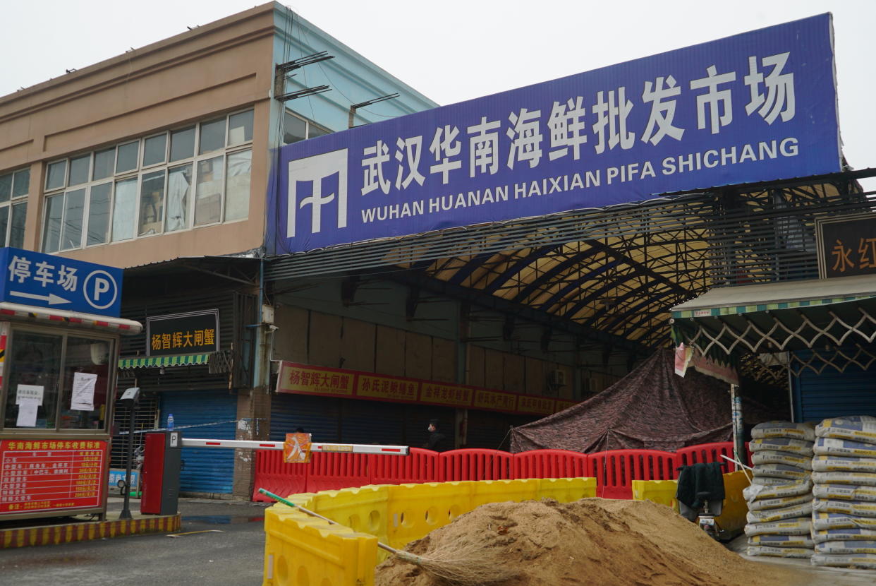 FILE - The Huanan Seafood Wholesale Market, sits closed in Wuhan in central China's Hubei province on Jan. 21, 2020. International scientists have examined previously unavailable genetic data from samples collected at a market in China close to where the first human cases of COVID-19 were detected and said they have found suggestions the pandemic originated from animals, not a lab. (AP Photo/Dake Kang, File)