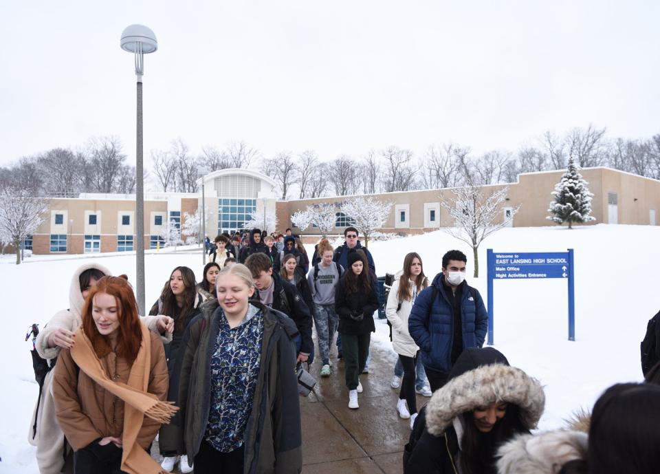 Students at East Lansing High School walk out of the school to demonstrate, Thursday, Jan. 26, 2023, to raise their voices against school violence.