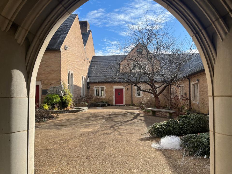 The courtyard of the BarberMcMurry-designed Grace Episcopal Church in Chattanooga can be seen through the arch-lined breezeway.