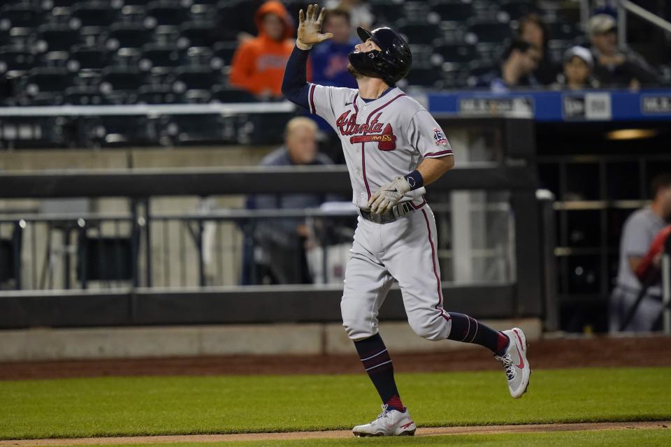 Atlanta Braves' Dansby Swanson gestures as he runs the bases after hitting a three-run home run during the third inning of a baseball game against the New York Mets Tuesday, June 22, 2021, in New York. (AP Photo/Frank Franklin II)