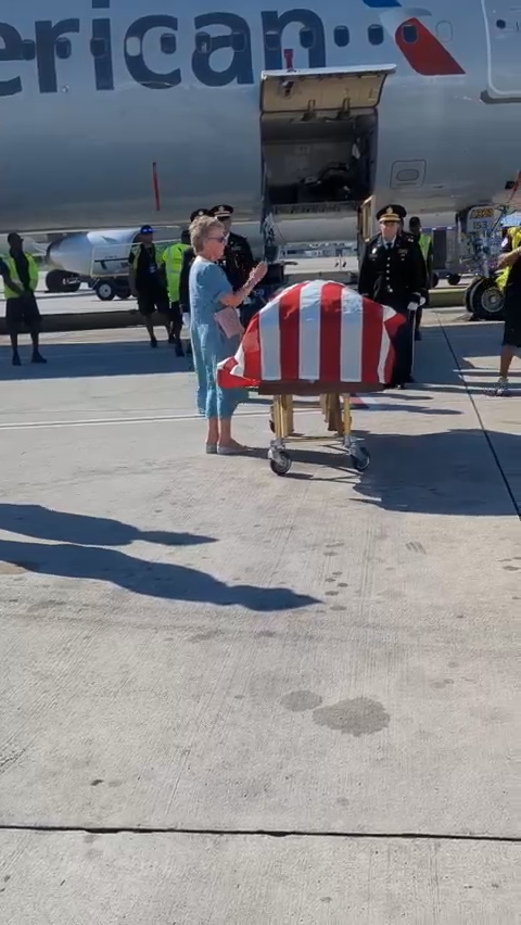 Searle's cousin, Betty Rhodes, receives his remains in Florida. She was born after Roy Searle died, and her DNA helped identify him.  [Provided by Boynton Memorial Chapel funeral home]