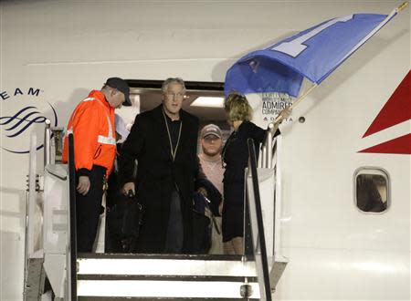 Seattle Seahawks head coach Pete Carroll exits the team's chartered plane as the Seahawks return home after winning NFL Super Bowl XLVIII at Seatac Airport in Seattle, Washington February 3, 2014. REUTERS/Jason Redmond