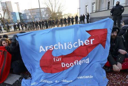 Activists block a street in front of the building where European far-right leaders meet, in Koblenz, Germany, January 21, 2017. REUTERS/Kai Pfaffenbach