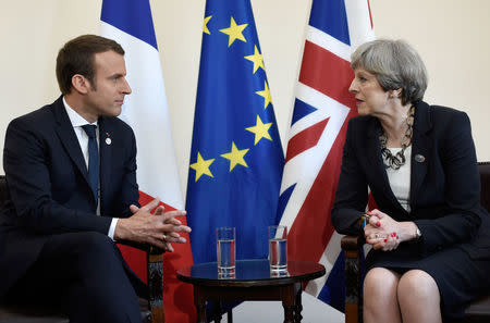 Britain's Prime Minister Theresa May and French President Emmanuel Macron talk during a bilateral meeting at the G7 Summit in Taormina, Sicily, Italy, May 26, 2017. REUTERS/Stephane De Sakutin/Pool