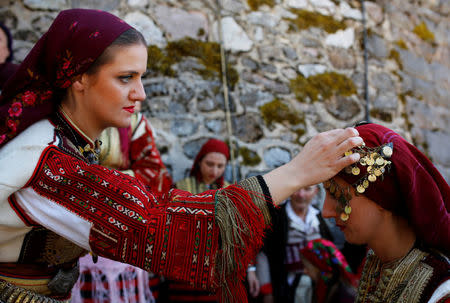 People dressed in folk costumes take part in a traditional wedding ceremony in the village of Galicnik, west of capital Skopje, Macedonia July 15, 2018. REUTERS/Ognen Teofilovski