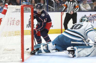 Columbus Blue Jackets forward Johnny Gaudreau (13) scores past San Jose Sharks goalie Magnus Chrona during the second period of an NHL hockey game in Columbus, Ohio, Saturday, March 16, 2024. (AP Photo/Paul Vernon)