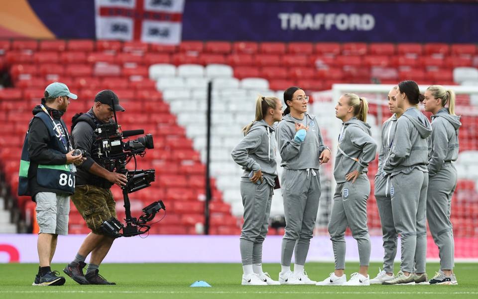 England players inspect the pitch before the opening match of the UEFA Women's EURO 2022 between England and Austria at the Old Trafford stadium in Manchester, Britain, 06 July 2022. UEFA Women's EURO 2022 - England vs Austria, Manchester, United Kingdom - Peter Powell/Shutterstock
