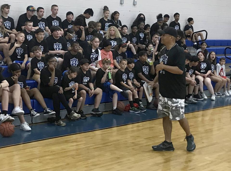 Erie police Lt. Tom Lenox, the city police department's Police Athletic League coordinator, addresses a group of PAL students during a weeklong camp at the Erie Boys & Girls Club on June 21, 2023. Participation in the league has grown to around 1,200 students and nearly 100 law enforcement officers.