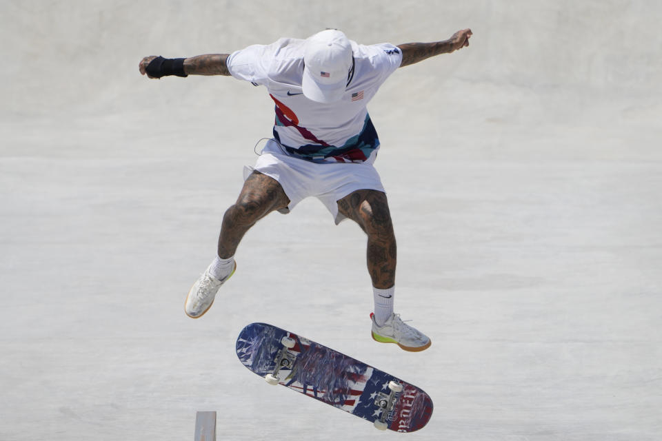 Nyjah Huston of the United States competes during the men's street skateboarding finals at the 2020 Summer Olympics, Sunday, July 25, 2021, in Tokyo, Japan. (AP Photo/Jae C. Hong)