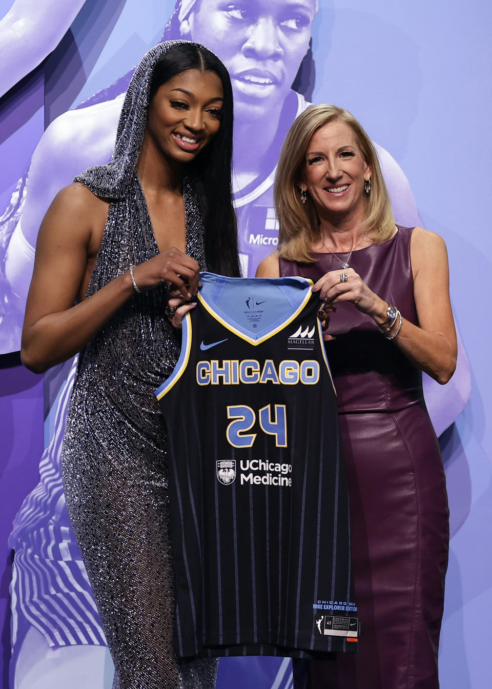 LSU's Angel Reese, left, poses for a photo with WNBA commissioner Cathy Engelbert after being selected seventh overall by the Chicago Sky during the first round of the WNBA basketball draft on Monday, April 15, 2024, in New York. (AP Photo/Adam Hunger)