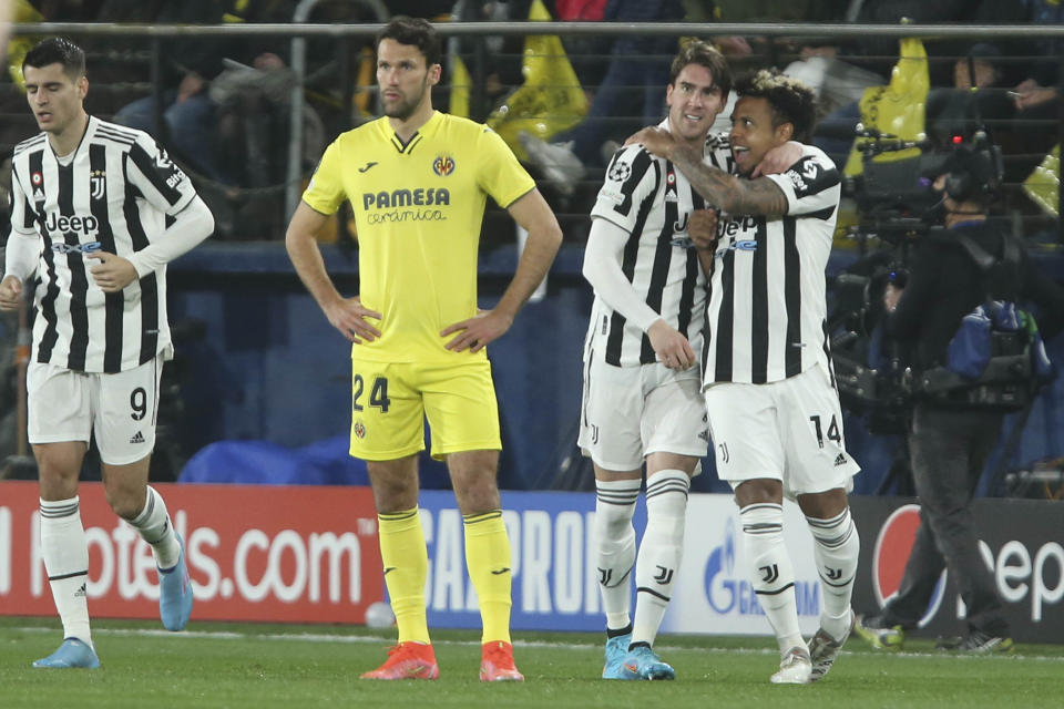 Juventus' Dusan Vlahovic, second right, celebrates after scoring his side's opening goal during the Champions League, round of 16, first leg soccer match between Villarreal and Juventus at the Ceramica stadium in Villarreal, in Villarreal, Spain, Tuesday, Feb. 22, 2022. (AP Photo/Alberto Saiz)