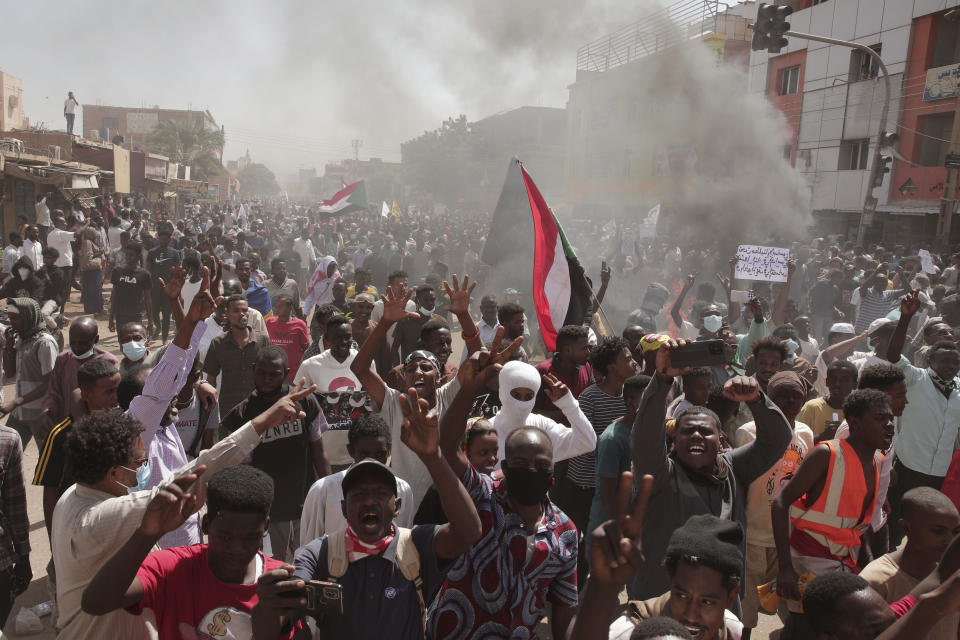 FILE - Sudanese demonstrators attend a rally to demand the return to civilian rule nearly a year after a military coup led by General Abdel Fattah al-Burhan, in Khartoum, Sudan, Oct. 25, 2022. Sudan’s ruling generals and the main pro-democracy group signed a framework deal on Monday, Dec. 5, 2022, until elections but key dissenters have stayed out of the agreement. The deal pledges to establish a new, civilian-led transitional government to guide the country to elections and offers a path forward in the wake of Sudan’s stalled transition to democracy following the October 2021 coup. (AP Photo/Marwan Ali, File)