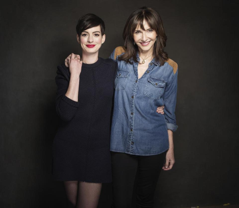 In this Tuesday, Jan. 21, 2014 photo, cast members Anne Hathaway and Mary Steenburgen pose for a portrait at The Collective and Gibson Lounge Powered by CEG, during the Sundance Film Festival, in Park City, Utah. The actresses starred in the film, "Song One," directed by Kate Barker-Froyland, which premiered at the 2014 Sundance Film Festival. (Photo by Victoria Will/Invision/AP)