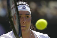 Tunisia's Ons Jabeur returns to Kazakhstan's Elena Rybakina in the final of the women's singles on day thirteen of the Wimbledon tennis championships in London, Saturday, July 9, 2022. (AP Photo/Kirsty Wigglesworth)