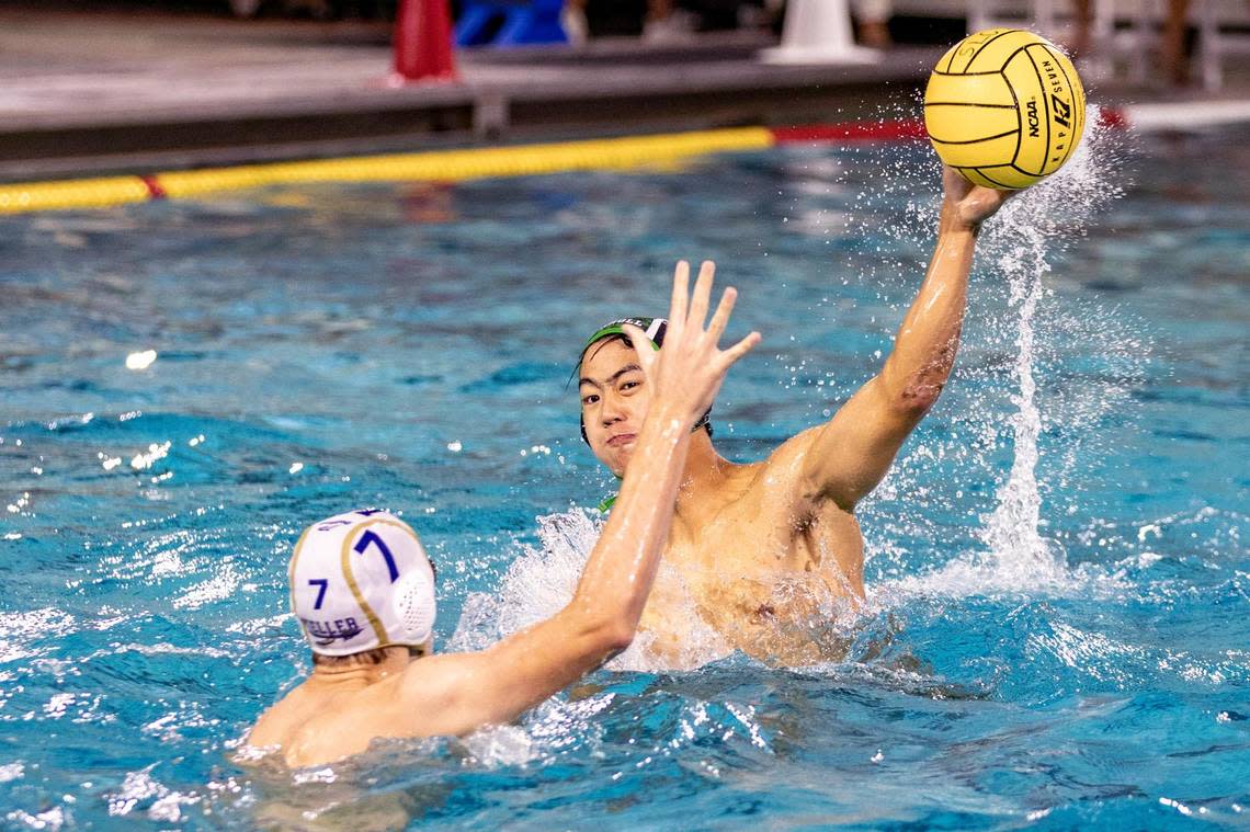 Southlake player Ian Yu throws a ball past his Keller competitor Connor McColl on Friday, Sept. 9. 2022, at the Carroll ISD Aquatics Center in Southlake, Texas.