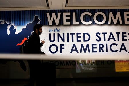 An international passenger arrives at Washington Dulles International Airport after the U.S. Supreme Court granted parts of the Trump administration's emergency request to put its travel ban into effect later in the week pending further judicial review, in Dulles, Virginia, U.S., June 26, 2017. REUTERS/James Lawler Duggan