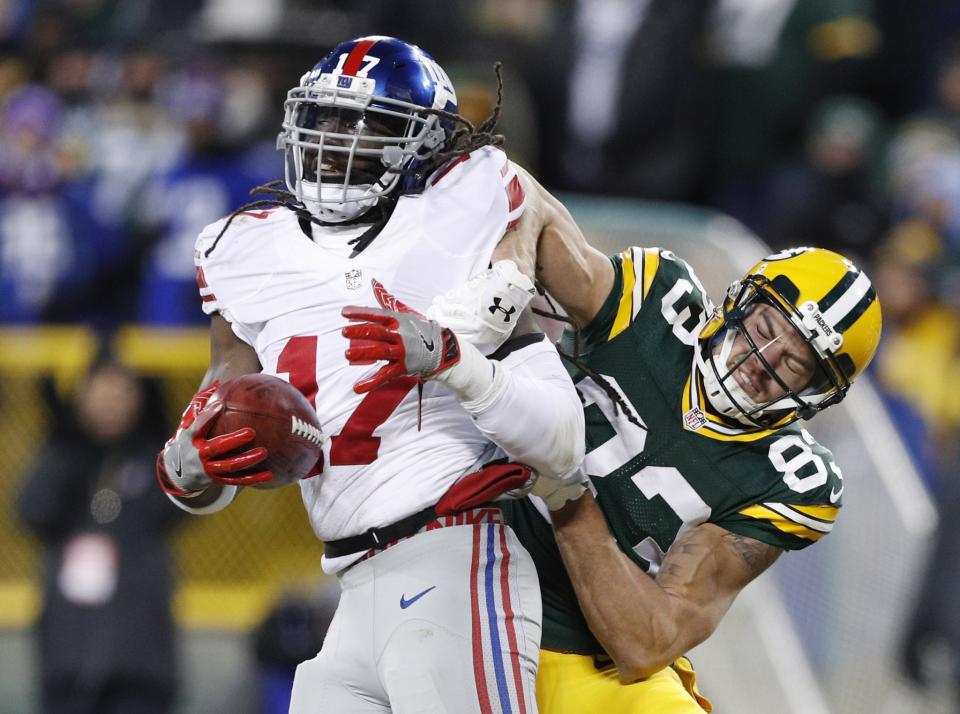 <p>New York Giants wide receiver Dwayne Harris (17) is tackled by Green Bay Packers wide receiver Jeff Janis (83) on a punt return during the first half in the NFC Wild Card playoff football game at Lambeau Field. Mandatory Credit: Jeff Hanisch-USA TODAY Sports </p>