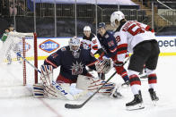 New York Rangers goalie Igor Shesterkin (31) blocks the net against New Jersey Devils' Janne Kuokkanen (59) during the first period of an NHL hockey game Thursday, April 15, 2021, in New York. (Bruce Bennett/Pool Photo via AP)