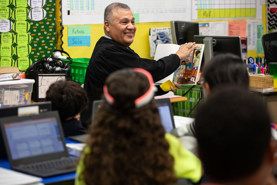 Judge Joe Benavides reads "Abuela" to a fifth grade class for Hispanic Heritage Month at Blanche Moore Elementary School on Thursday, Sept. 28, 2023, in Corpus Christi, Texas.