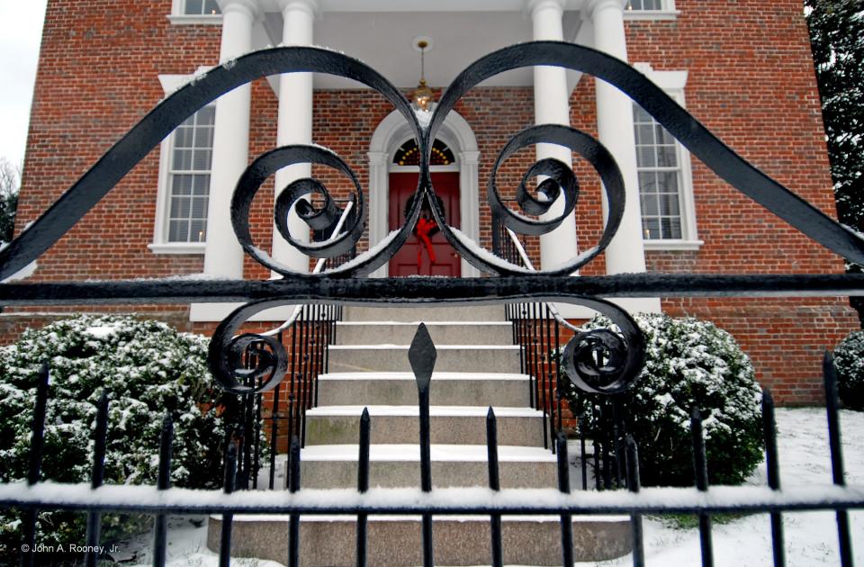 Snow on the gate of a home on High St. in Petersburg.