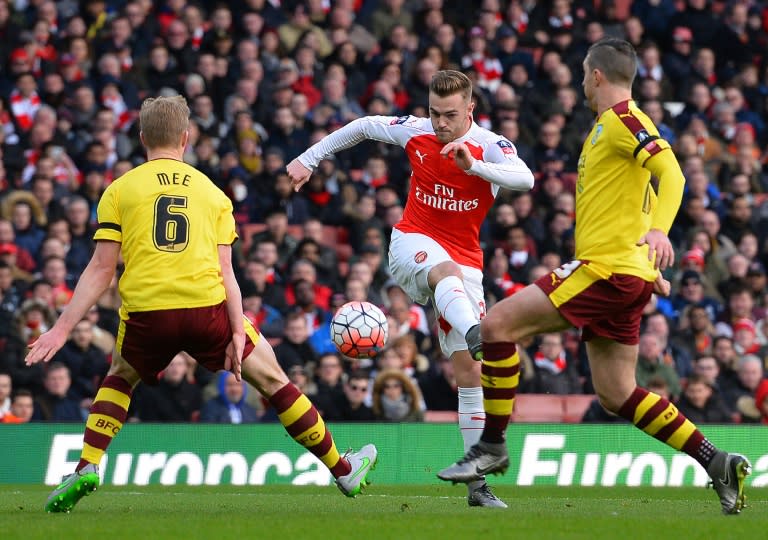 Arsenal's defender Calum Chambers (C) scores his team's first goal during the English FA Cup fourth round match against Burnley at the Emirates stadium in London, on January 30, 2016